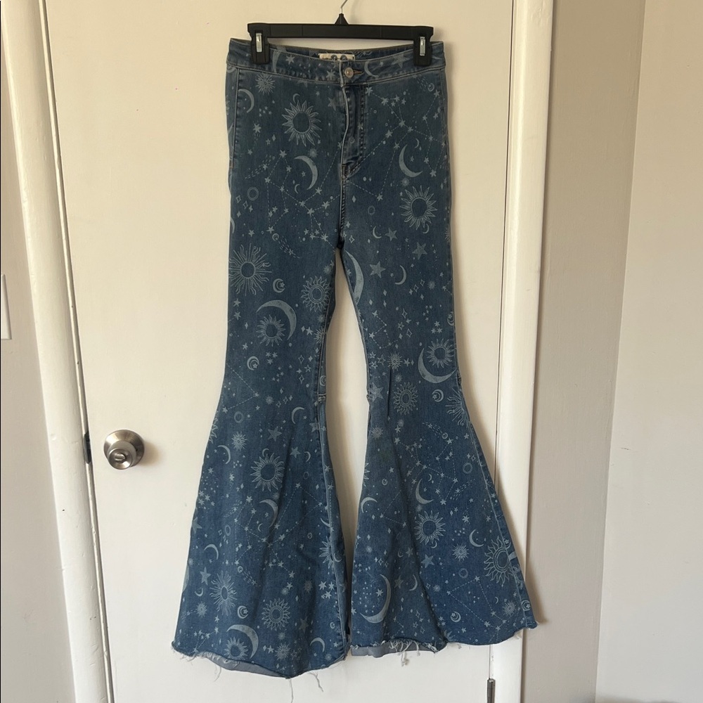 We The Free Blue Flare Jeans with Celestial Print